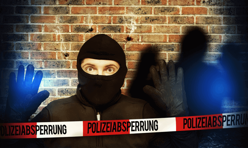 Einbrecher mit Polizeiabsperrung